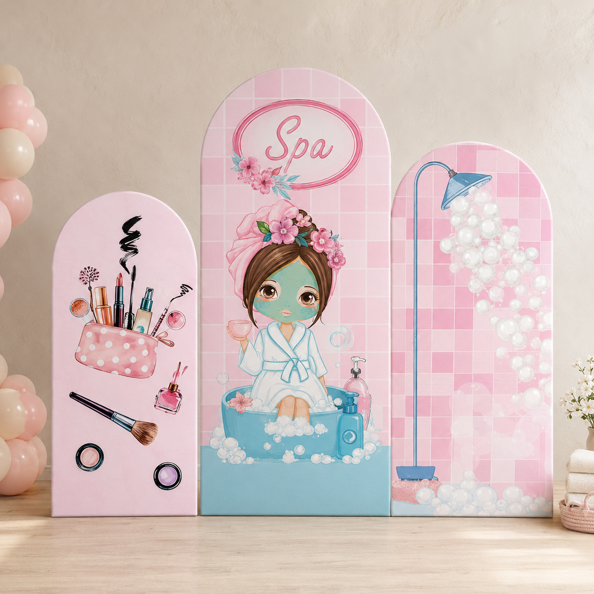 Three pink arched decorative panels with spa-themed illustrations, displayed on a tabletop against a beige wall. The left panel shows makeup items, the center panel shows a woman in a bathtub with flowers and the word 'Spa', and the right panel shows a shower scene with bubbles.